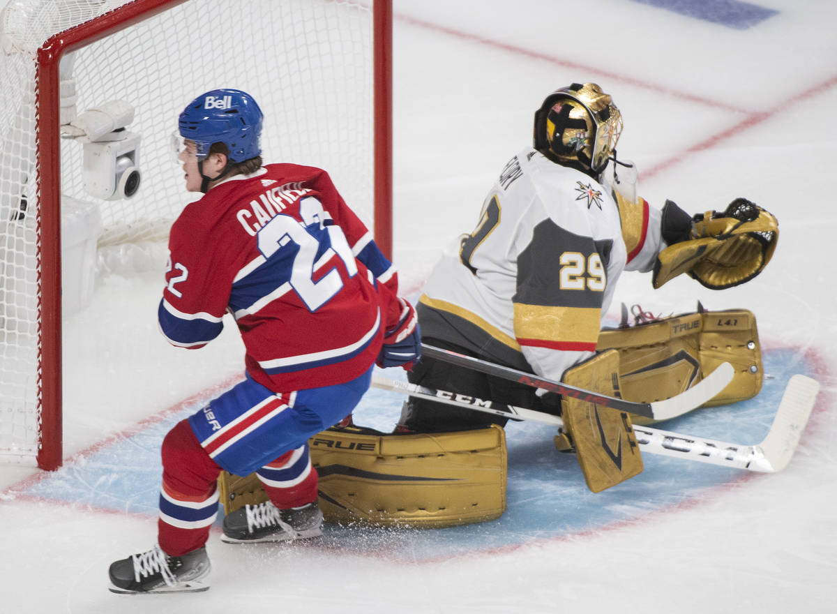 Montreal Canadiens' Cole Caufield scores against Vegas Golden Knights goaltender Marc-Andre Fle ...