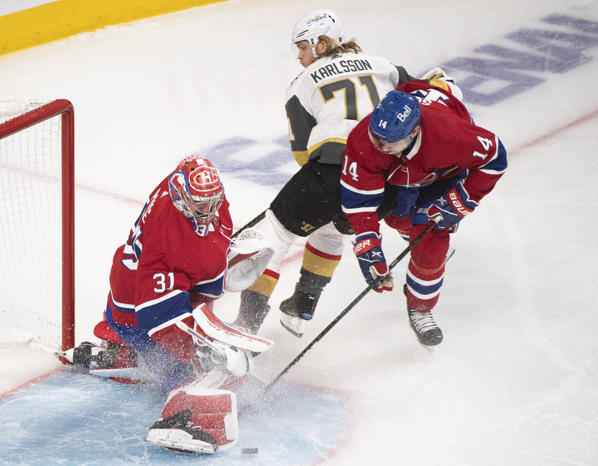 Montreal Canadiens goaltender Carey Price stops Vegas Golden Knights' William Karlsson (71) as ...