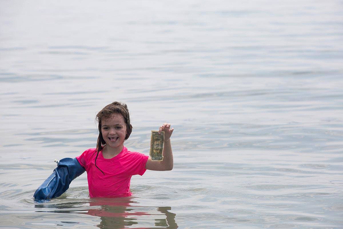 Anna Beth Pratt, 6, on a road trip with her family from Mississippi, finds a dollar along Bould ...