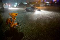 Motorists navigate a flooded Gause Boulevard in Slidell, La., late Friday, June 18, 2021, as a ...