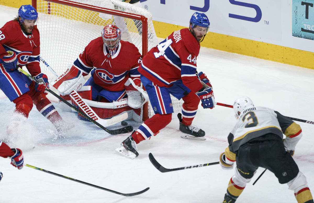 Vegas Golden Knights' Brayden McNabb scores past Montreal Canadiens goaltender Carey Price as C ...