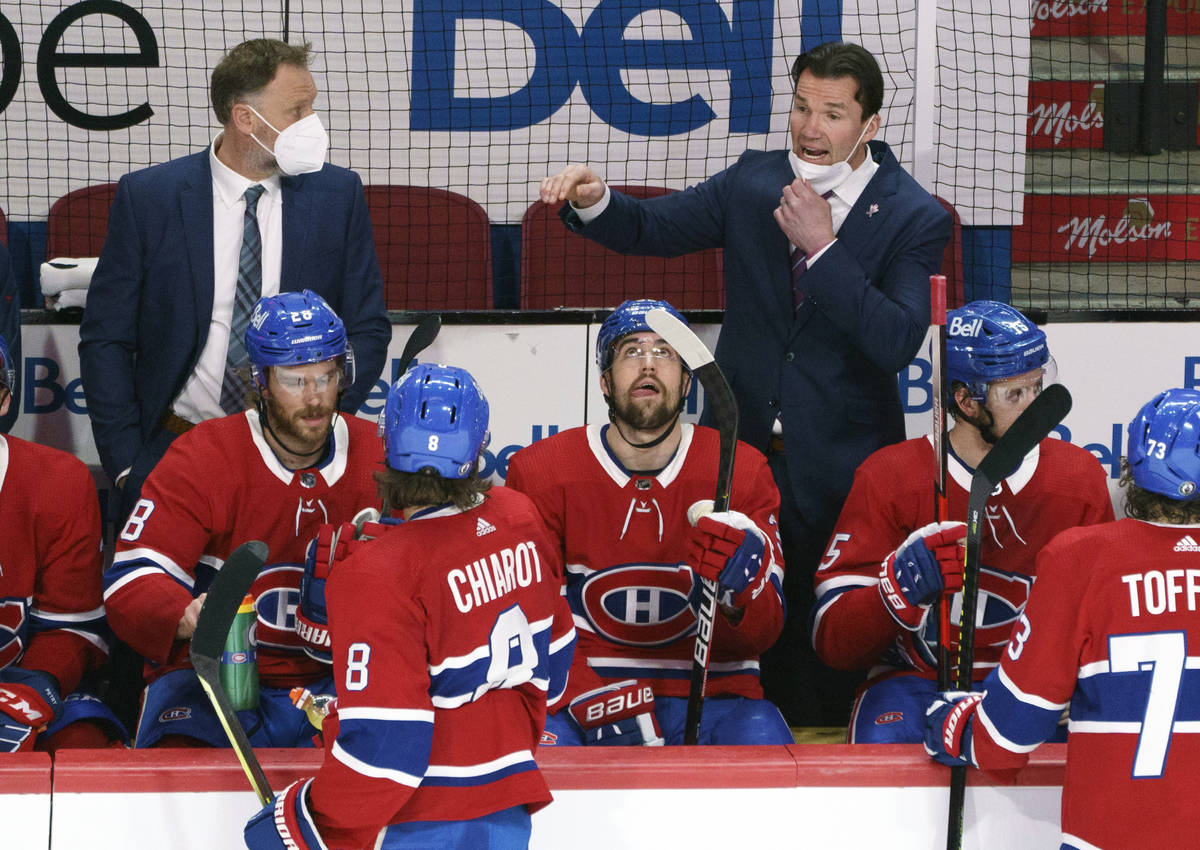 Montreal Canadiens replacement coach Luke Richardson gives instructions during a break in play ...