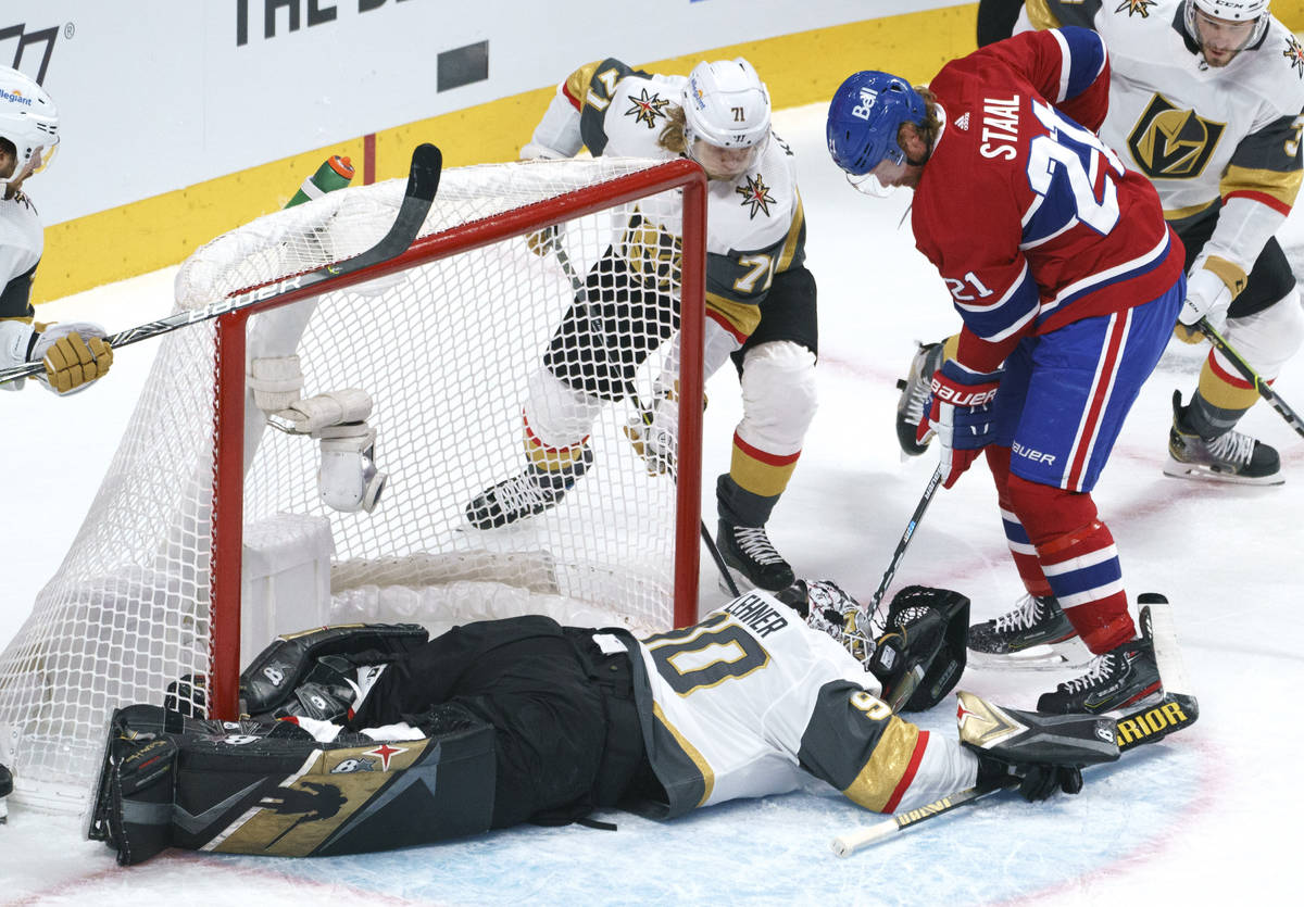 Montreal Canadiens' Eric Staal tries to poke the puck away from Vegas Golden Knights goaltender ...