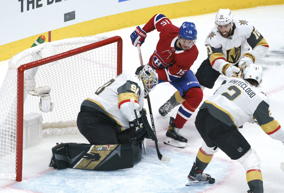 Vegas Golden Knights goaltender Robin Lehner makes a save off Montreal Canadiens' Jesperi Kotka ...