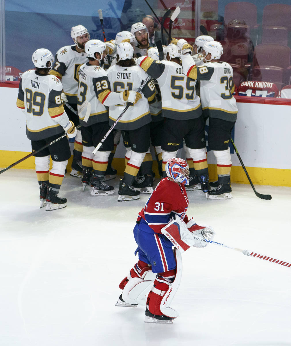 Montreal Canadiens goaltender Carey Price skates off the ice as members of the Vegas Golden Kni ...