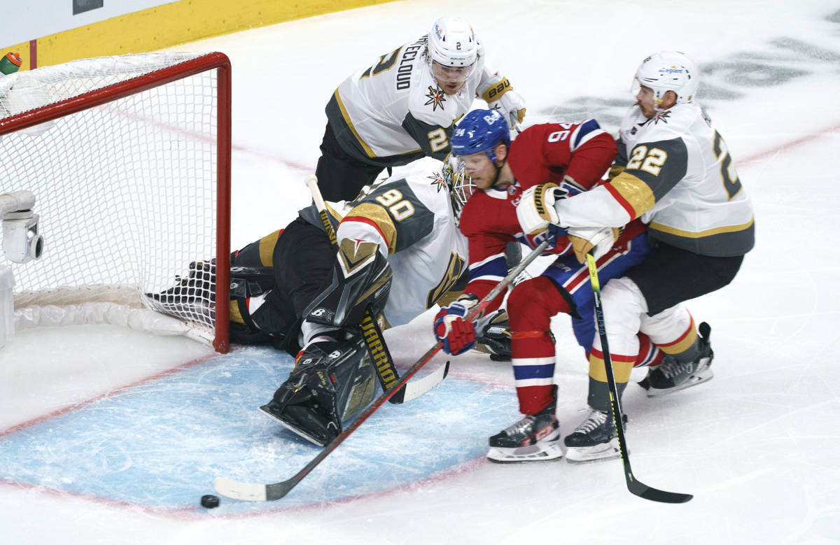 Montreal Canadiens' Corey Perry can't get the puck past a net left empty by Vegas Golden Knight ...