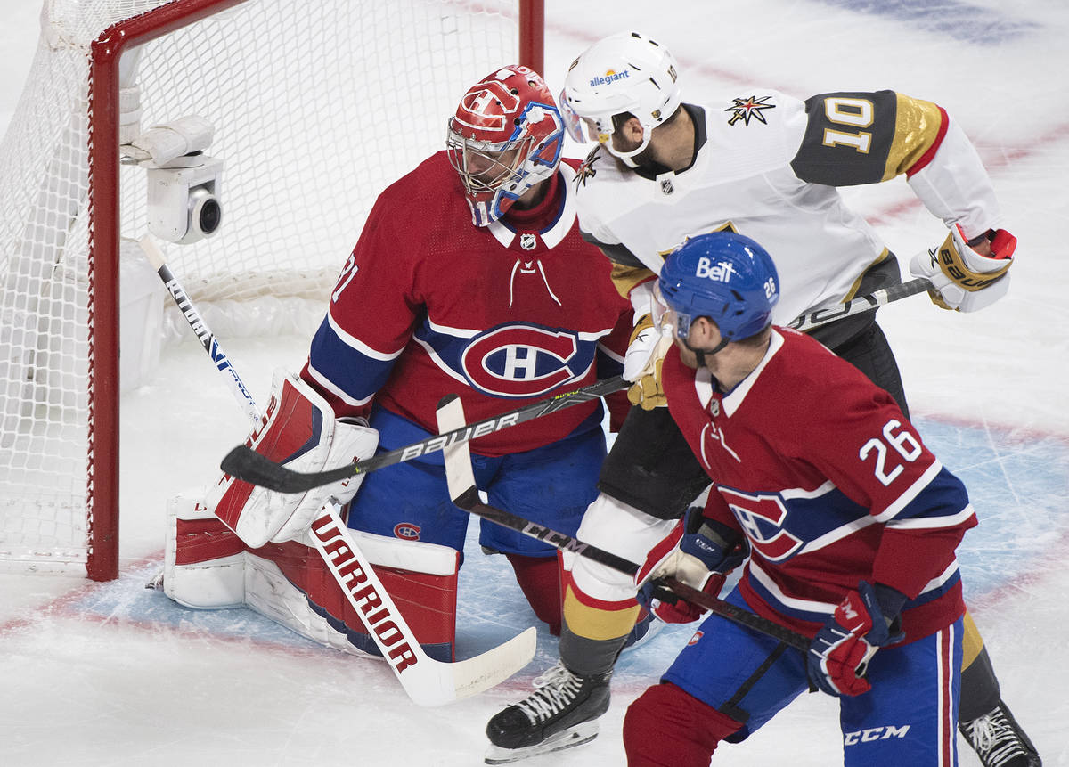 Vegas Golden Knights' Nicolas Roy (10) moves in aagainst Montreal Canadiens goaltender Carey Pr ...