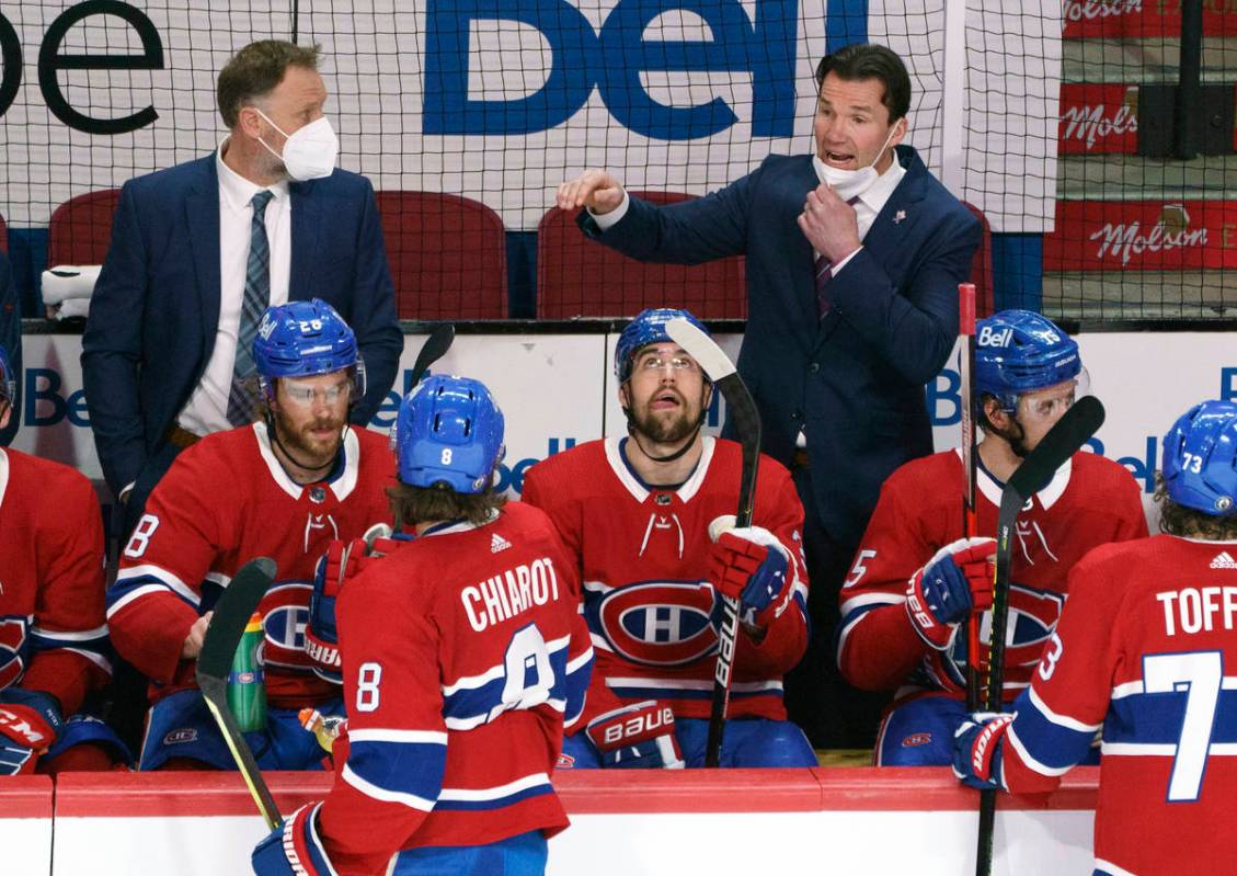 Montreal Canadiens replacement coach Luke Richardson gives instructions during a break in play ...