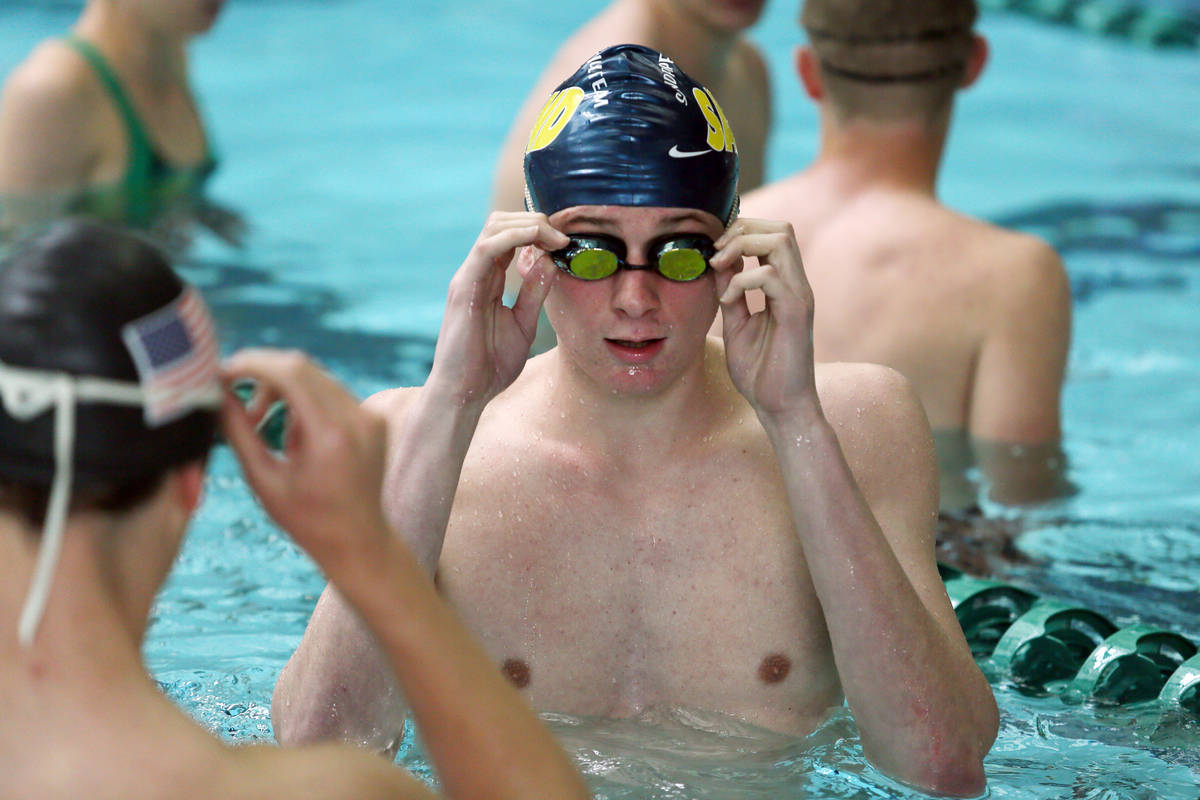 Palo Verde senior Bowen Becker, 17, center, puts on his goggles during practice at Pavilion Cen ...