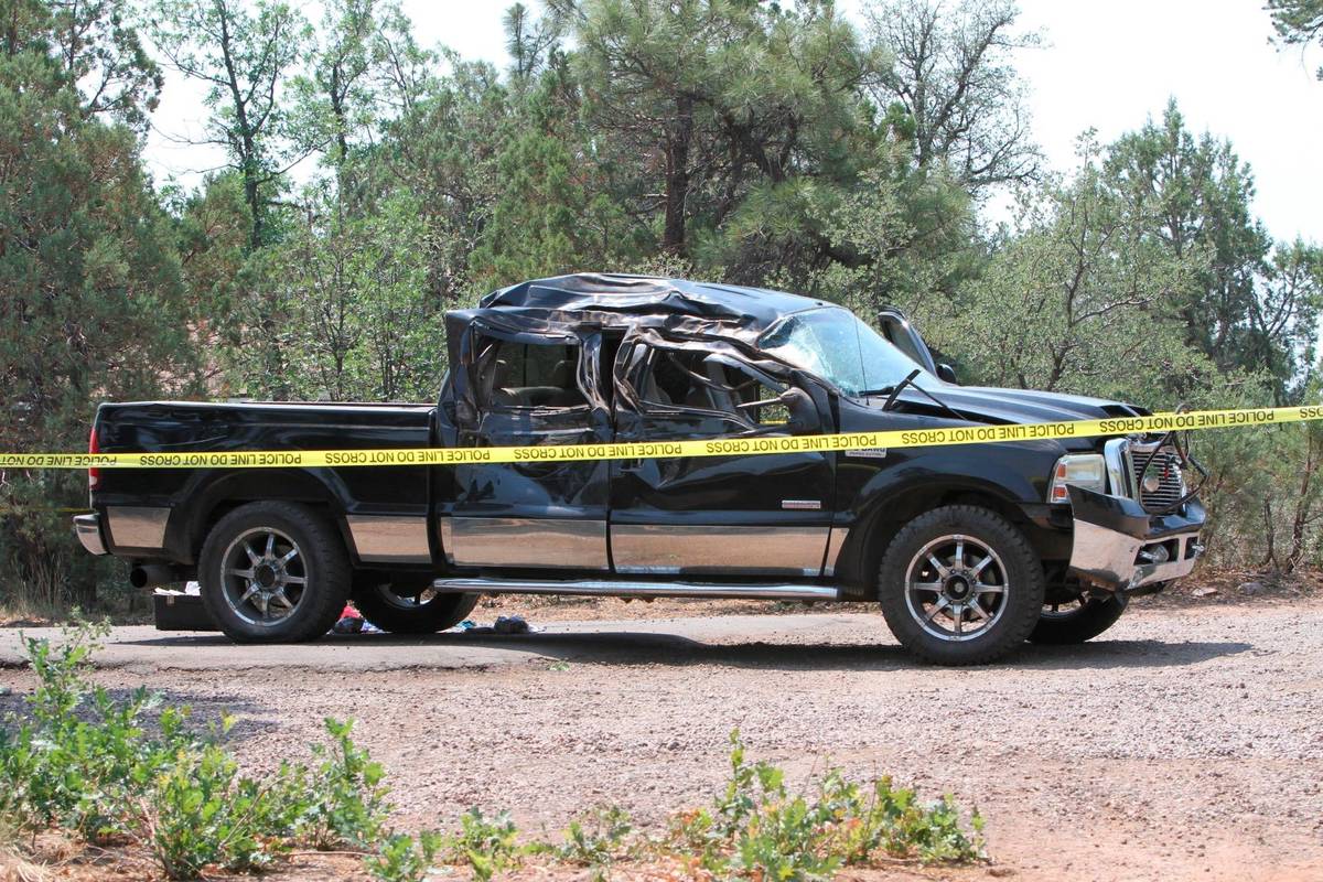 This photo shows a damaged pickup truck which ran over a group of cyclists in Show Low, Ariz., ...