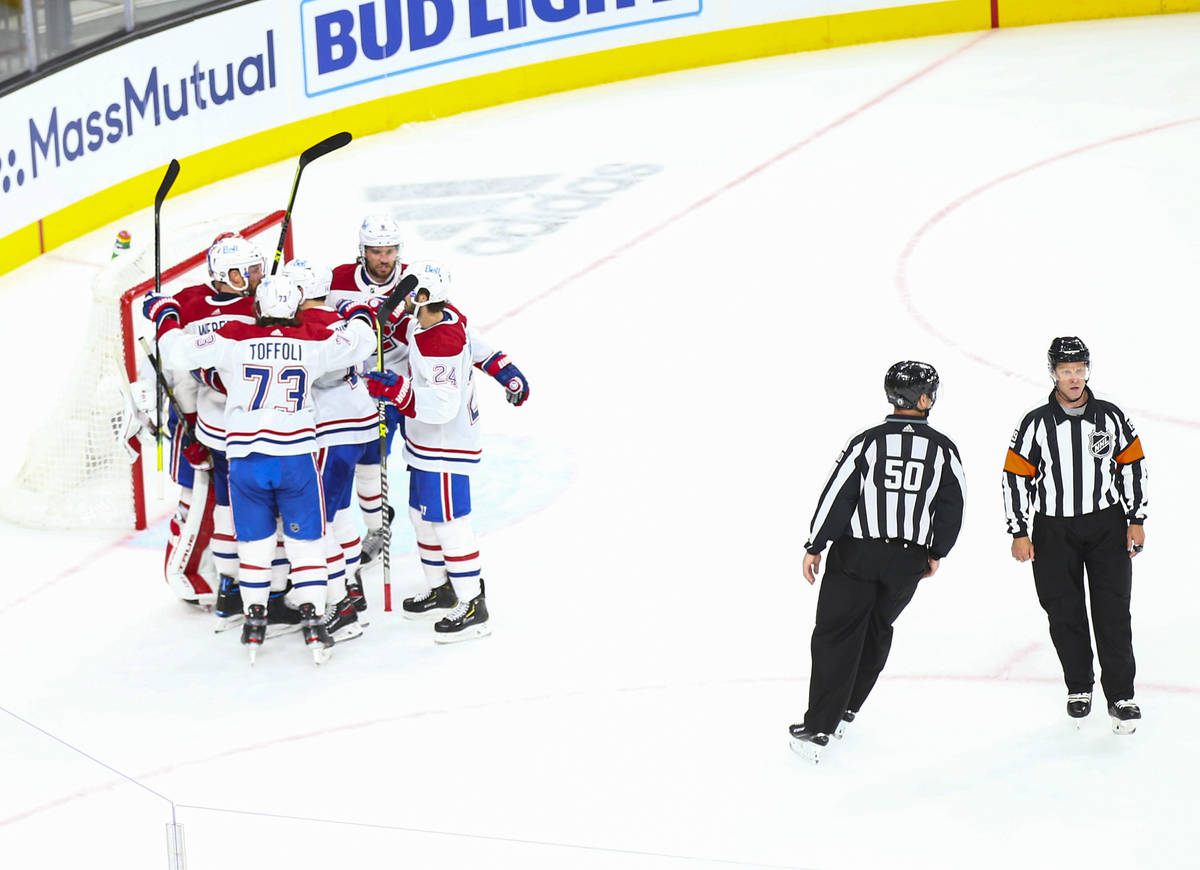 The Montreal Canadiens celebrate after defeating the Golden Knights in Game 2 in an NHL hockey ...