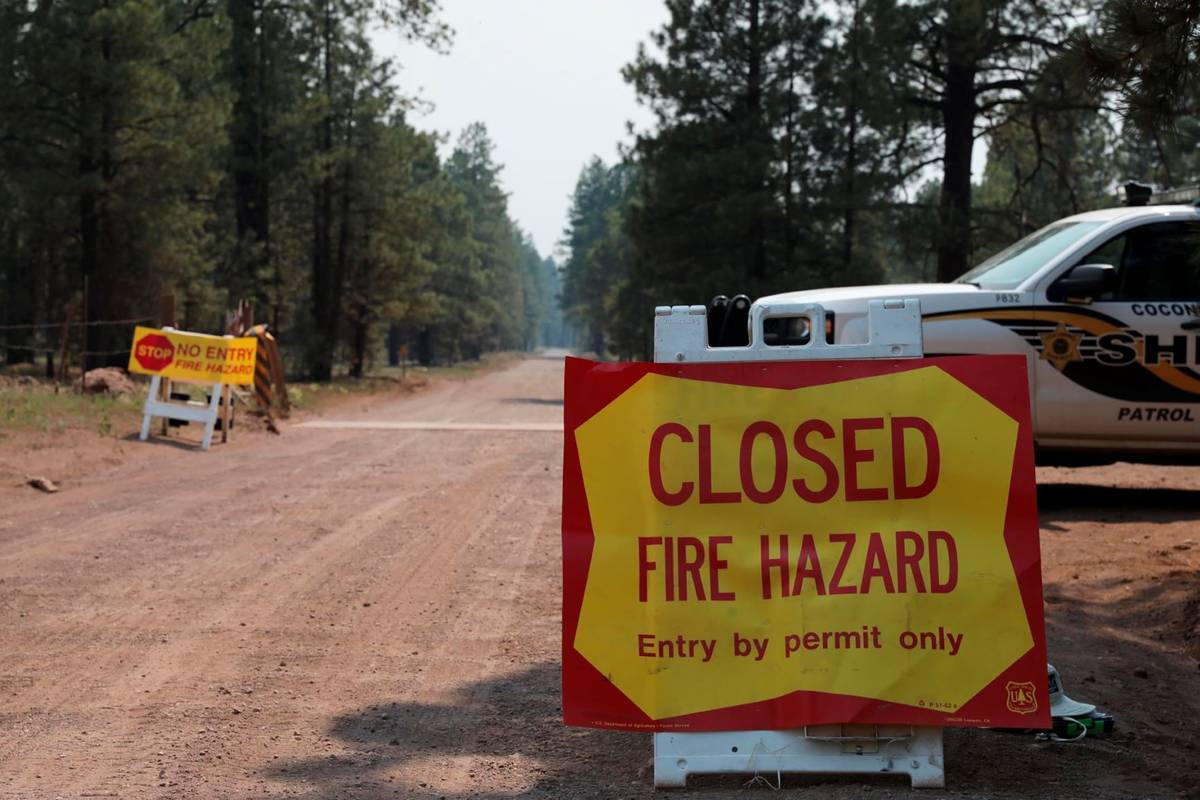 The Coconino County Sheriff's Office blocks off a U.S. Forest Service Road outside of Flagstaff ...