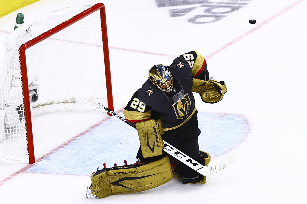 Golden Knights goaltender Marc-Andre Fleury blocks shot off his left shoulder during the second ...