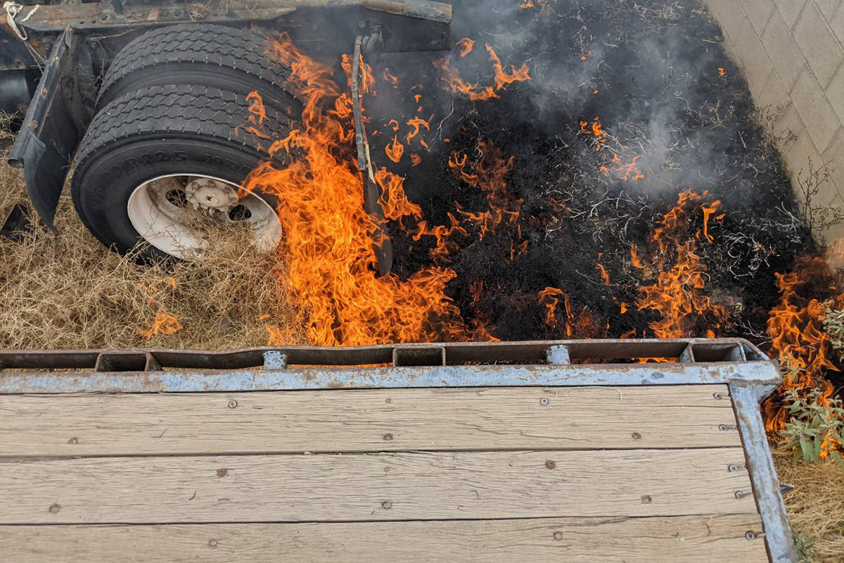 Crews battle a fire Tuesday, June 22, 2021, off West Owens Avenue in Las Vegas. (Las Vegas Fire ...