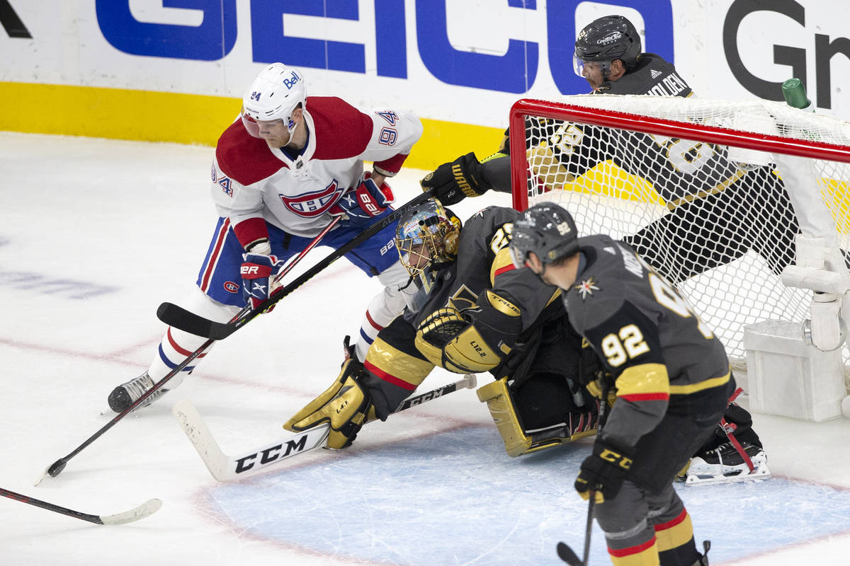 Canadiens right wing Corey Perry (94) attempts a goal while Golden Knights goaltender Marc-Andr ...