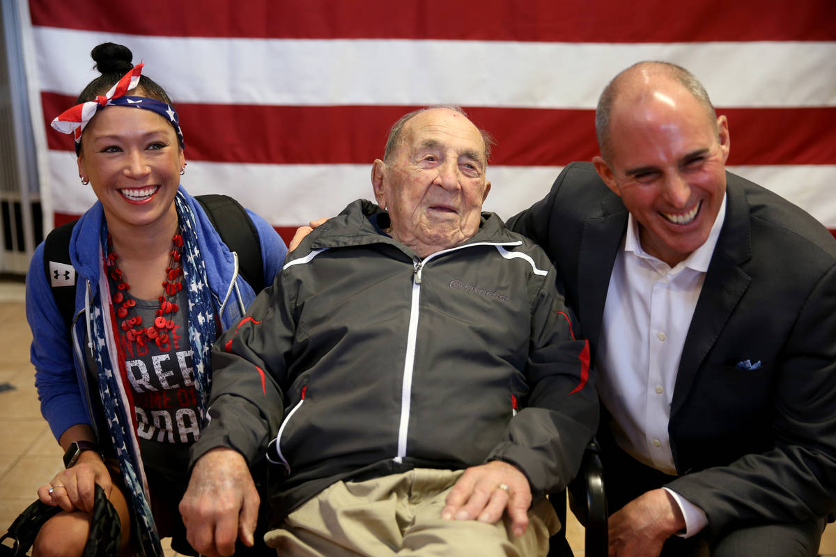 Joe Rosa, of Las Vegas, greets 24 Hour Fitness Service Manager Letitia Williams, 36, ...