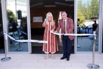 Dr. Miriam Adelson cuts a ribbon with Professor Yehuda Shoenfeld, president of Ariel University ...