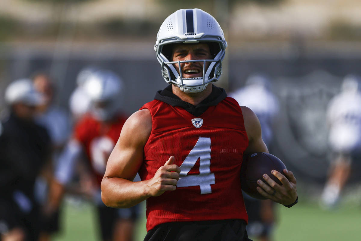Raiders quarterback Derek Carr trains during an NFL football minicamp at Raiders headquarters i ...