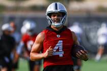 Raiders quarterback Derek Carr trains during an NFL football minicamp at Raiders headquarters i ...
