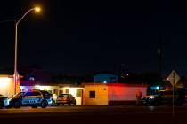 Las Vegas police investigate the scene of a homicide on Boulder Highway north of Russell Road i ...