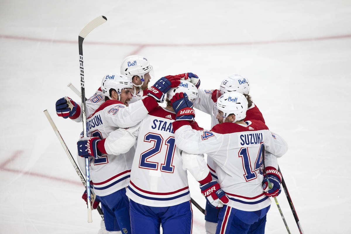 The Canadiens congratulate center Eric Staal (21) for scoring a goal on Golden Knights goaltend ...