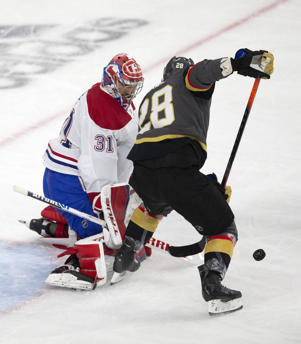 Canadiens goaltender Carey Price (31) saves a shot by Golden Knights left wing William Carrier ...