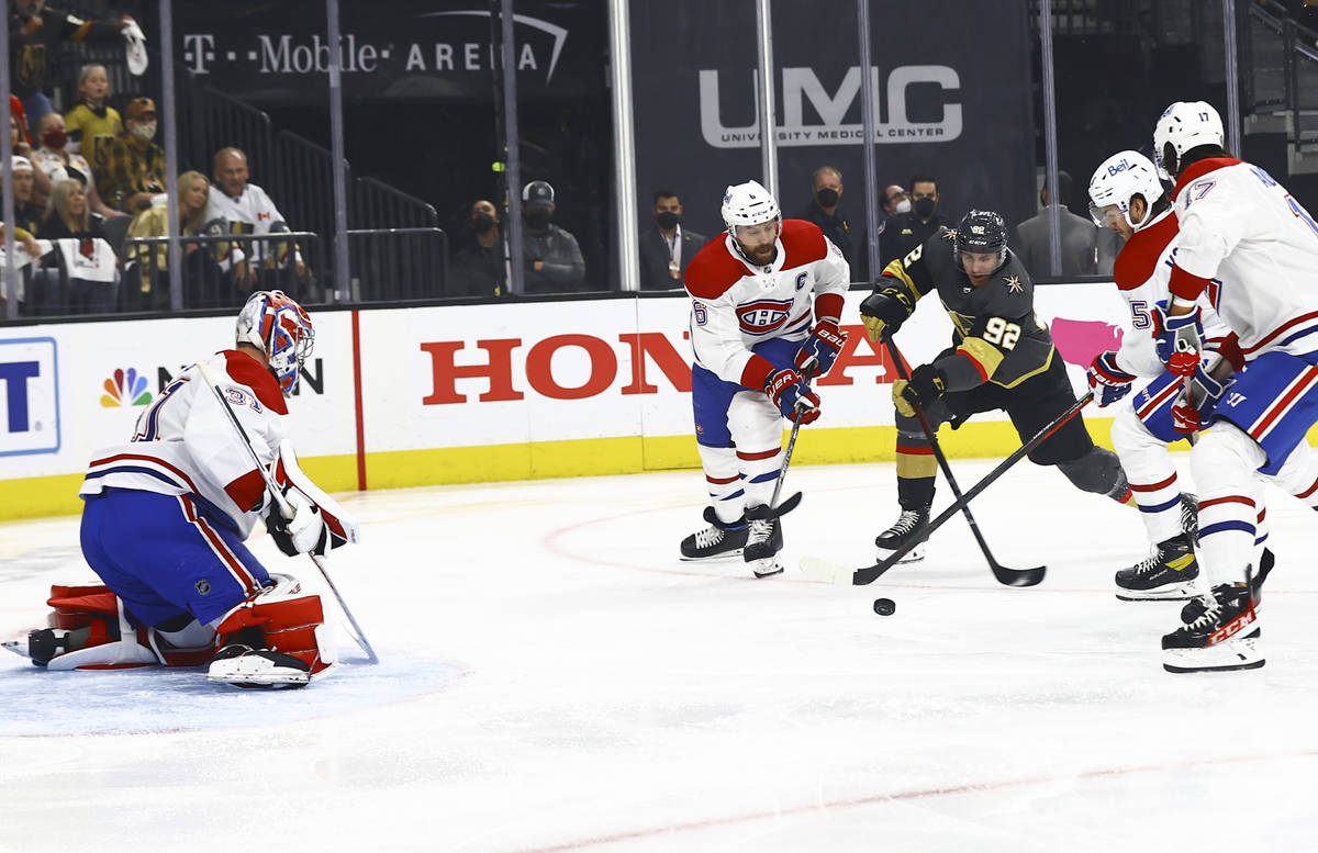 Golden KnightsÕ Tomas Nosek (92) looks to shoot under pressure from Montreal Canadiens' Sh ...