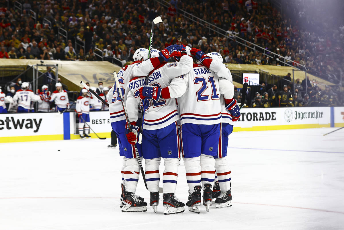 The Montreal Canadiens celebrate their first goal of the second period of Game 5 of an NHL hock ...