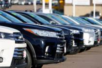 A long row of unsold used Highlander sports-utility vehicles is seen at a Toyota dealership in ...