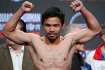 Manny Pacquiao poses on the scale during a weigh-in Friday, July 19, 2019, in Las Vegas. Pacqui ...