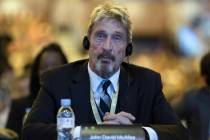 FILE - In this Tuesday, Aug. 16, 2016 file photo, software entrepreneur John McAfee listens dur ...