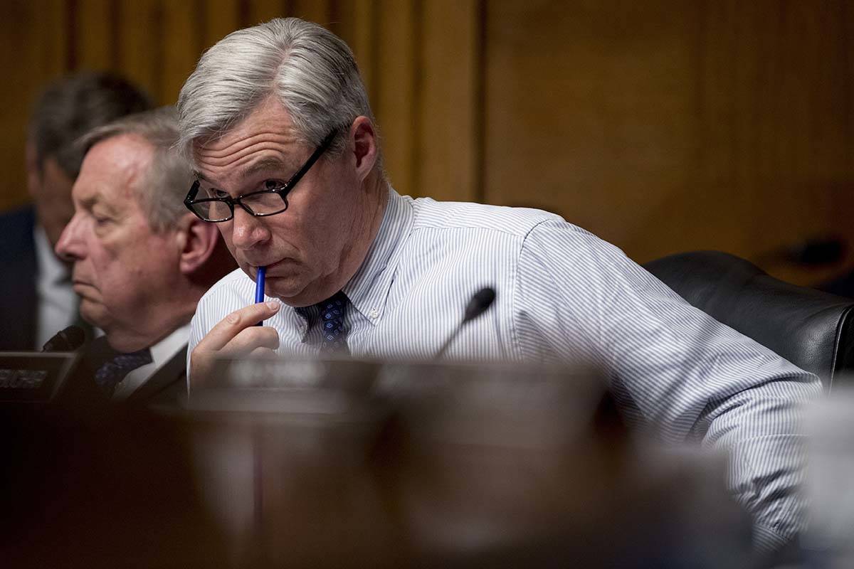 Sen. Sheldon Whitehouse, D-R.I., right. (AP Photo/Andrew Harnik)