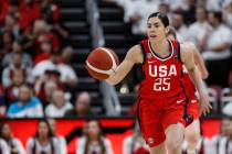 In this Feb. 2, 2020, file photo, USA Women's National Team guard Kelsey Plum drives the ball u ...