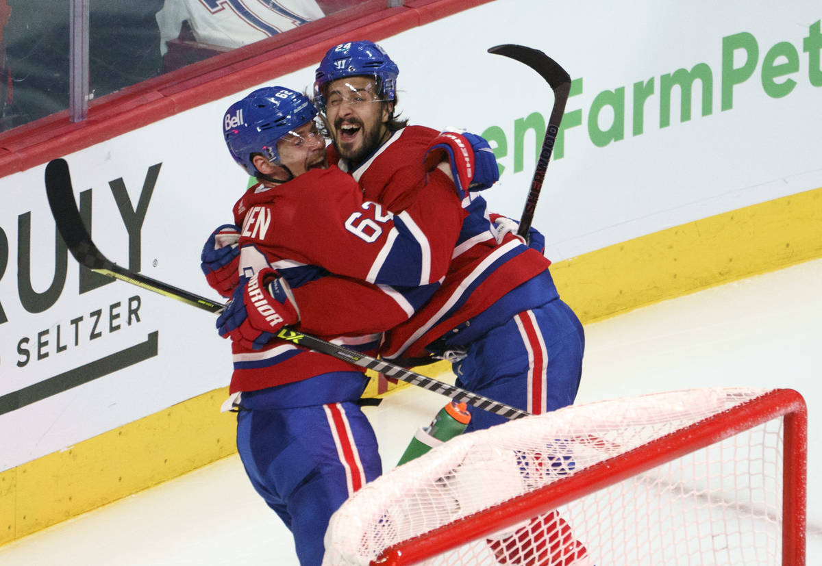 Montreal Canadiens' Artturi Lehkonen (62) celebrates his game-winning goal with teammate Philli ...