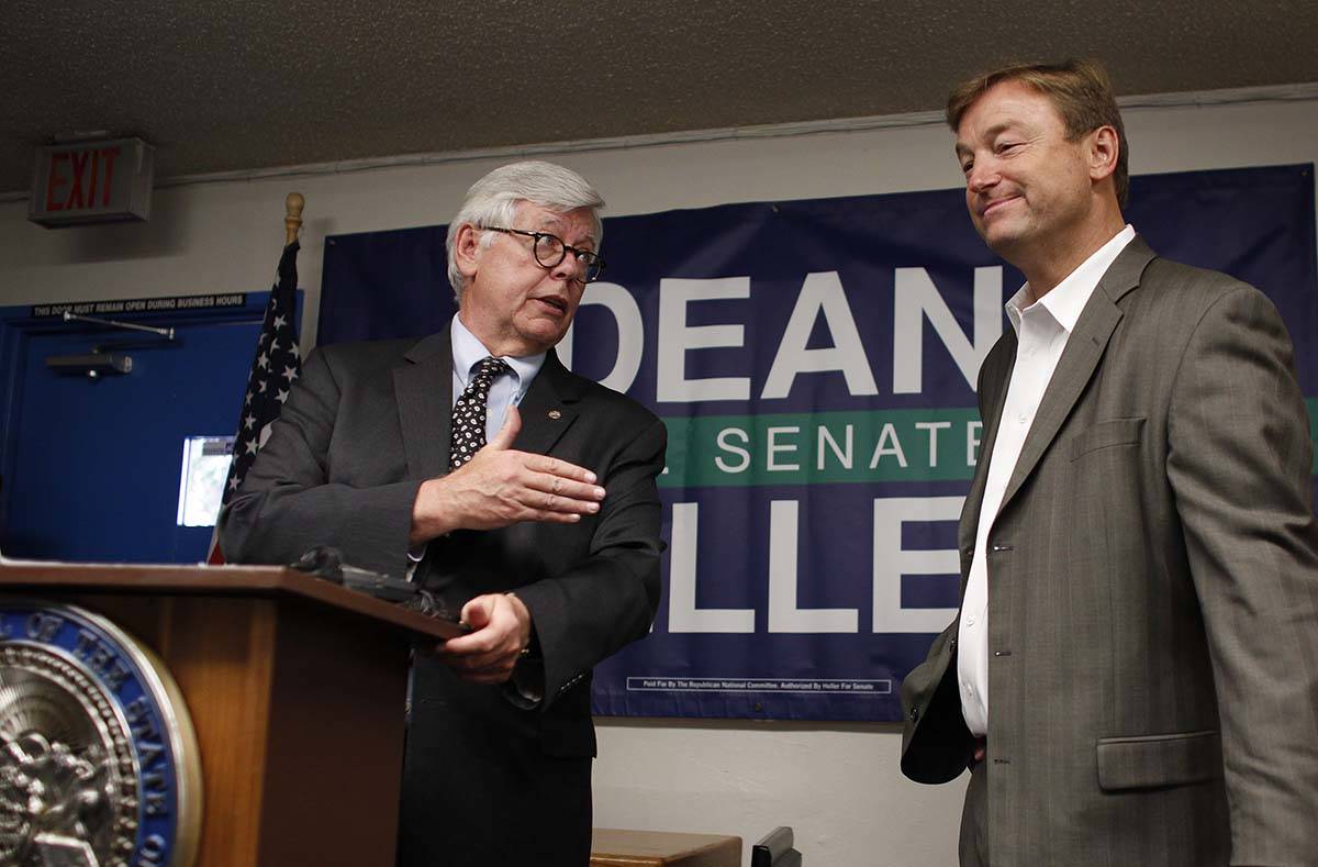 National Rifle Association President David Keene, left, announces the NRA's endorsement of Sen. ...