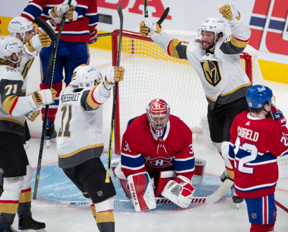 Vegas Golden Knights' Alec Martinez (23) celebrates after scoring the second goal on Montreal C ...