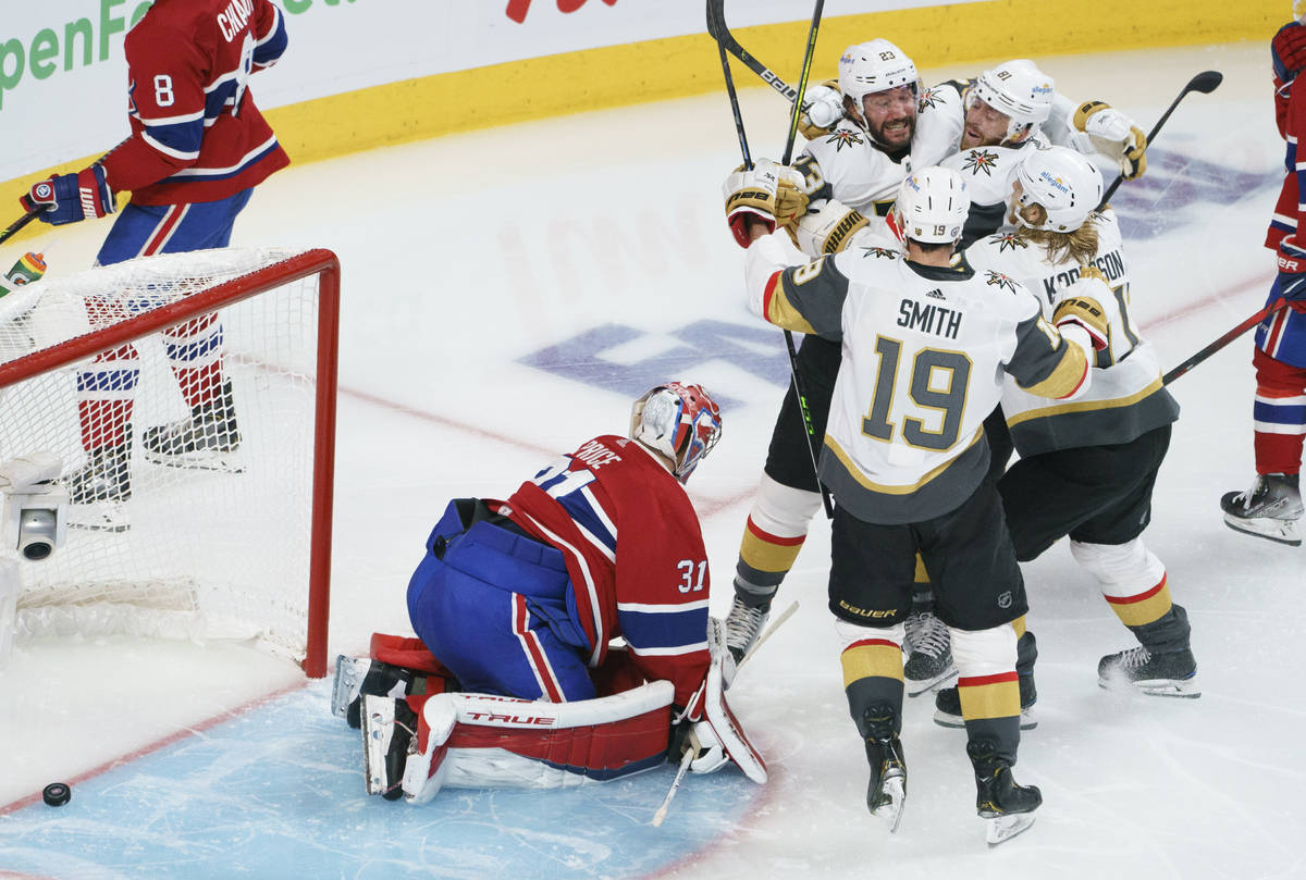 Vegas Golden Knights' Alec Martinez (23) celebrates his goal with teammates as Montreal Canadie ...
