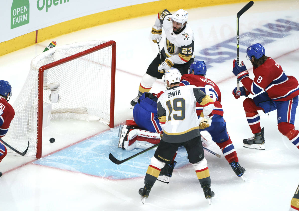 Vegas Golden Knights' Alec Martinez (23) scores past Montreal Canadiens goaltender Carey Price ...