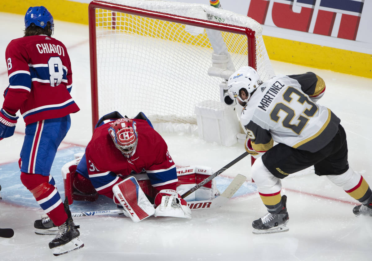 Vegas Golden Knights' Alec Martinez (23) scores on Montreal Canadiens goaltender Carey Price (3 ...