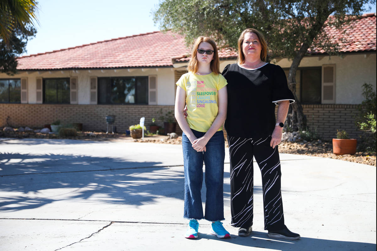 Lisa Skurow and her daughter Abby Skurow, 10, outside their home in southwest Las Vegas, Friday ...