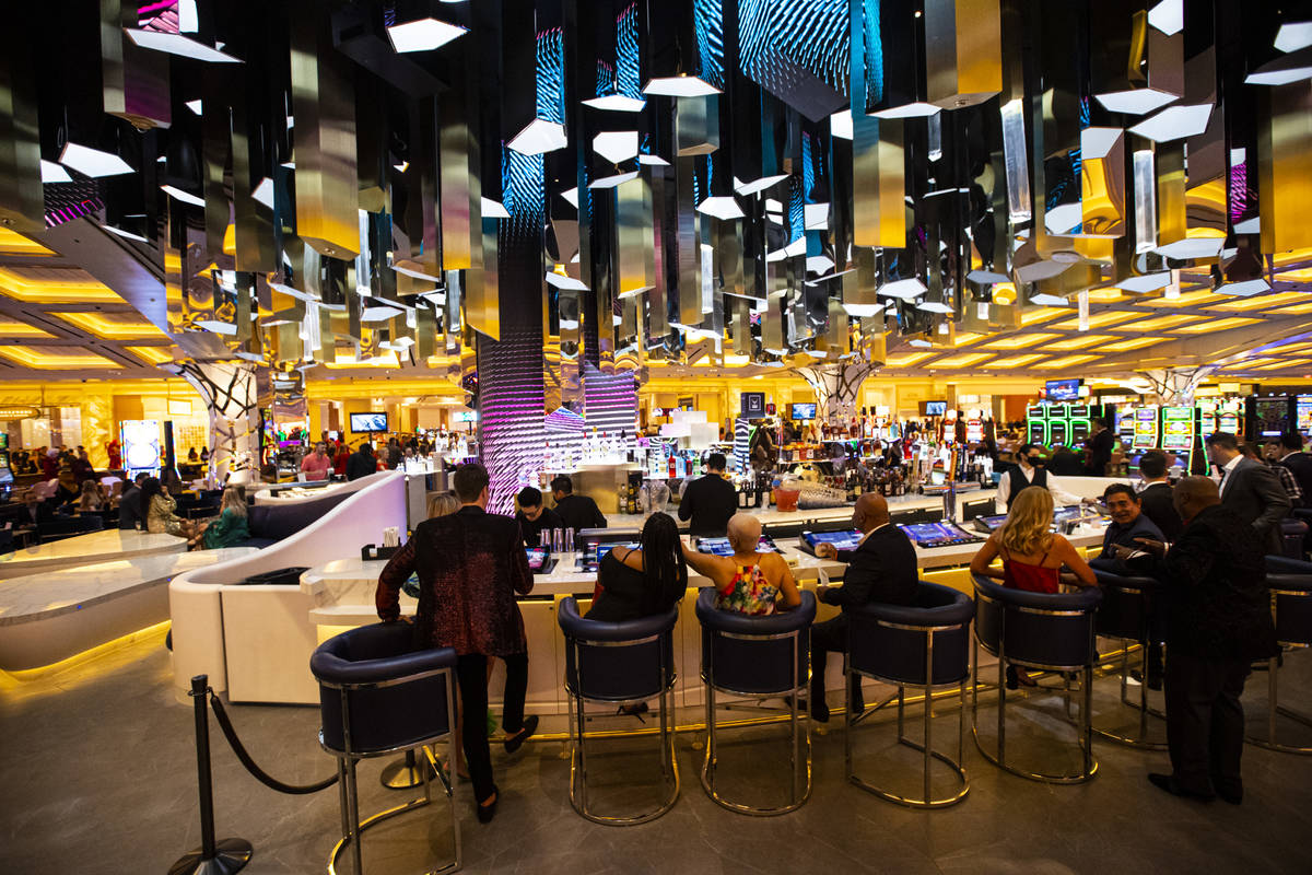 People mingle at the Crystal Bar during the opening night of Resorts World Las Vegas on Thursda ...