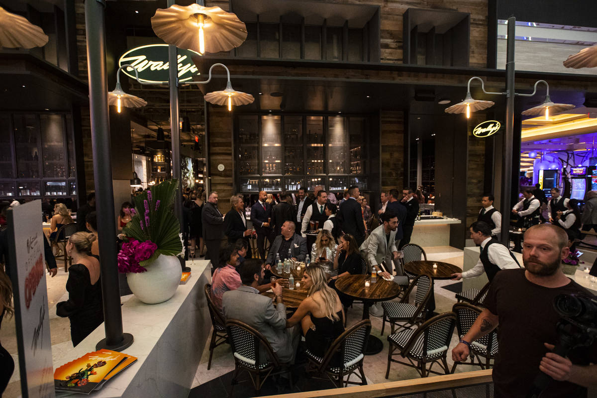 People drink and mingle at Wally's during the opening night of Resorts World Las Vegas on Thurs ...