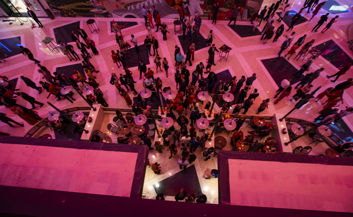 People walk around The District during the opening night of Resorts World Las Vegas on Thursday ...