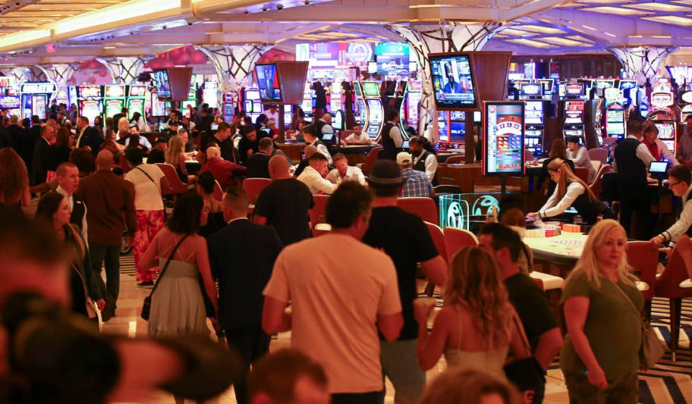 People gamble on the casino floor as Resorts World Las Vegas opens to the public on Thursday, J ...