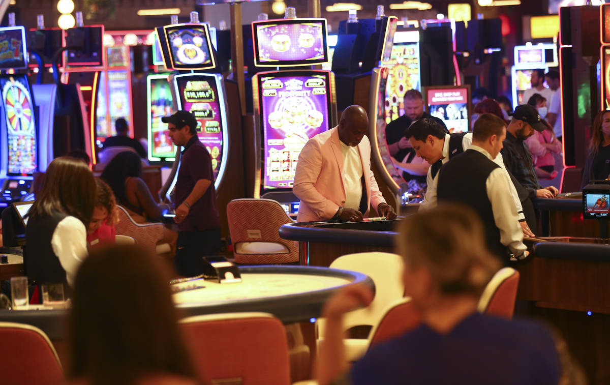 People gamble on the casino floor as Resorts World Las Vegas opens to the public on Thursday, J ...