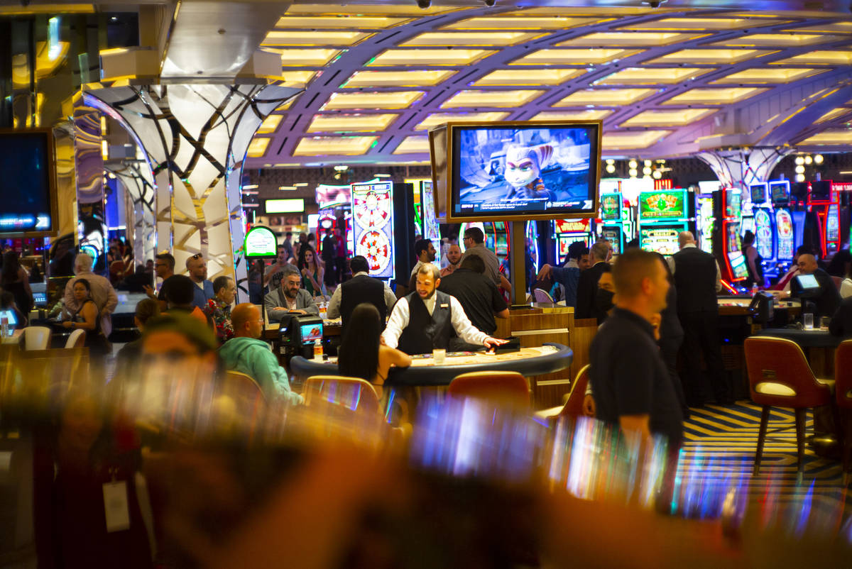 People gamble on the casino floor as Resorts World Las Vegas opens to the public on Thursday, J ...