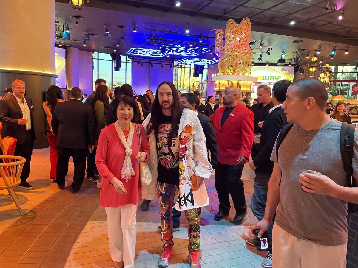 Steve Aoki poses in front of his restaurant, Kuru Kuru Pa Yakitori at Resorts World on Thursday ...