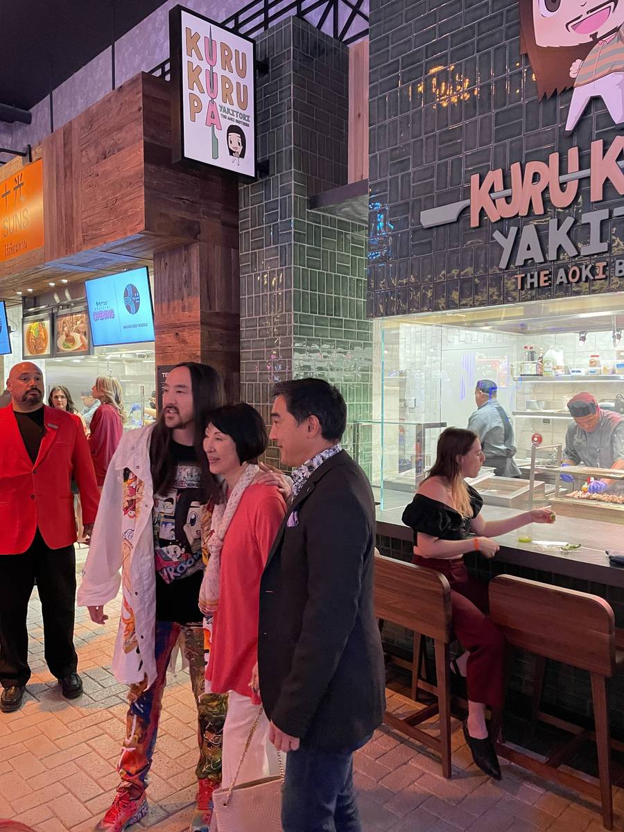 Steve Aoki poses in front of his restaurant, Kuru Kuru Pa Yakitori at Resorts World on Thursday ...