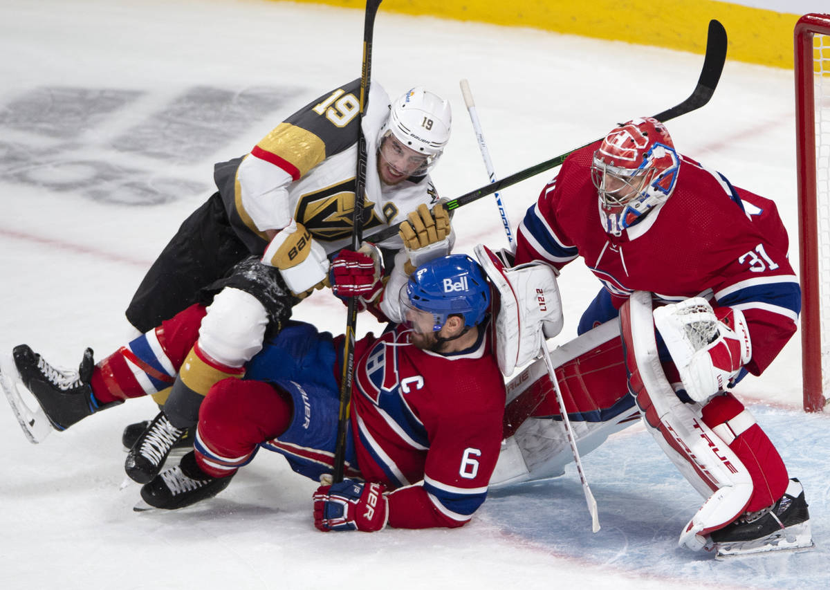 Vegas Golden Knights right wing Reilly Smith (19) battles with Montreal Canadiens defenseman Sh ...