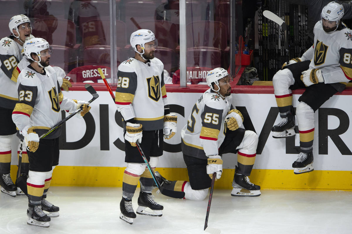 Vegas Golden Knights players watch the Montreal Canadiens celebrate following overtime in Game ...